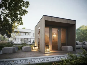 Nowoczesna sauna ogrodowa Harma ze szklanymi drzwiami i oknami na tarasie z lampionami i pufami.